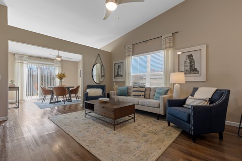A living room with a dark blue sofa and a coffee table.