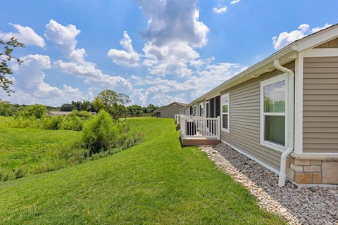 A row of houses with a grassy area in between.