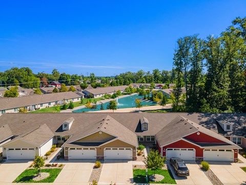 A suburban neighborhood with houses and a swimming pool.