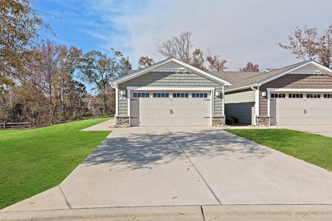 A two-car garage with a driveway in front.