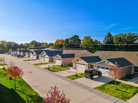 A suburban neighborhood with houses and trees.