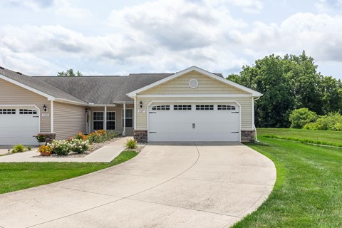 A two-car garage with a driveway leading to it.
