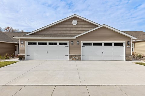 A two-car garage is attached to a house.