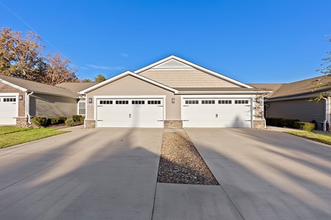 A two-car garage is attached to a house.