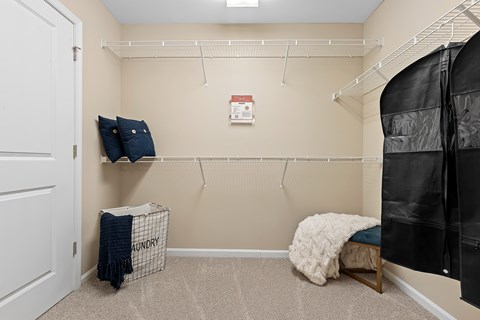 A laundry room with a washer and dryer in a small space.