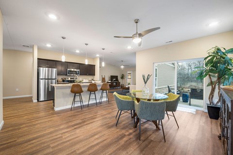 A modern kitchen with a dining table and chairs.