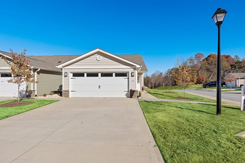 A house with a garage and a driveway.