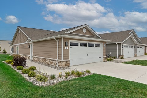 A house with a garage and a driveway.