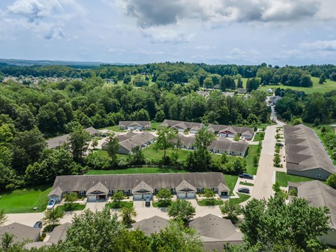 A bird's eye view of a residential area with houses and trees.