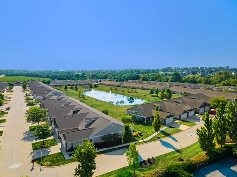 A residential area with houses and a swimming pool.