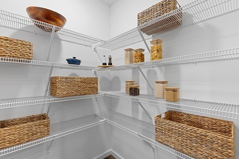 A white refrigerator with baskets on the shelves.