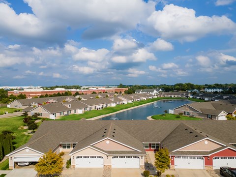 A suburban neighborhood with houses and a pool.