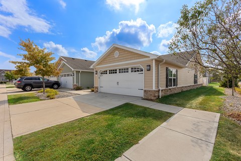 A house with a garage and a driveway.