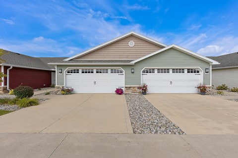 A two-car garage is attached to a house.