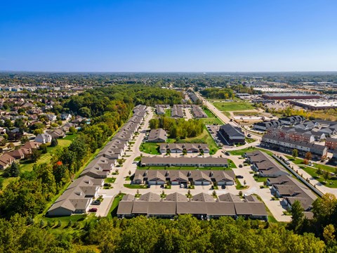 A bird's eye view of a residential area with houses and apartment buildings.