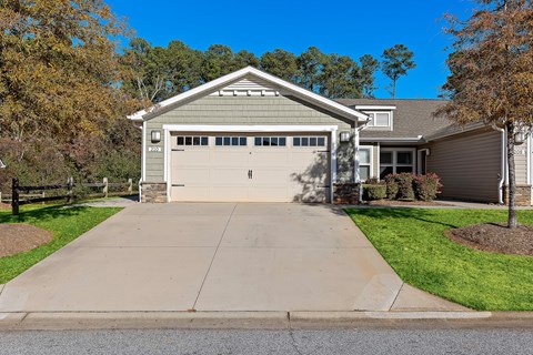 A two-car garage is attached to a house.