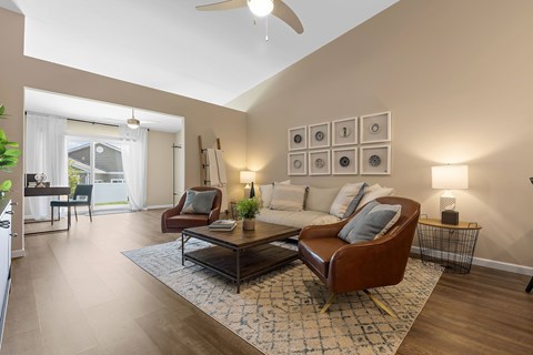 A living room with a brown leather chair and a coffee table.