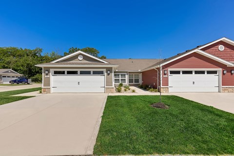 A two-car garage is attached to a house.