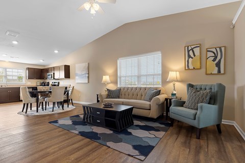 A living room with a grey couch and a coffee table.