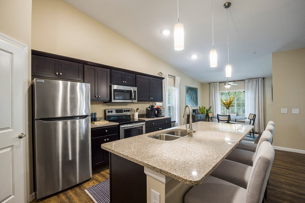 a kitchen with stainless steel appliances and a granite counter top