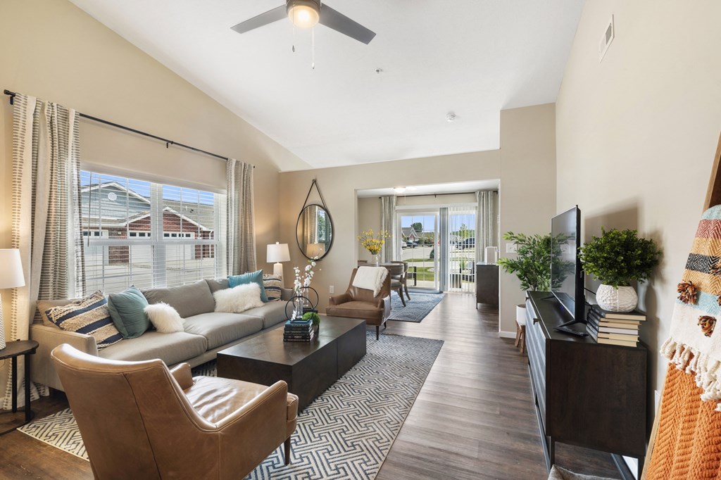 an open living room with a couch and a tv