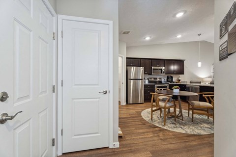 a kitchen and dining room with a table and chairs