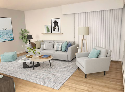 A living room with a grey sofa, a grey armchair, a coffee table, and a rug.