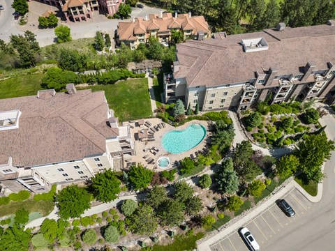 An aerial view of a residential area with a swimming pool.
