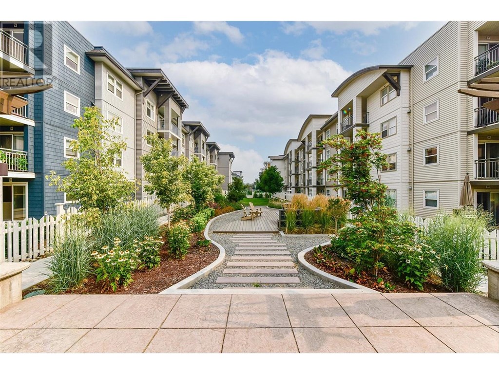 A residential area with apartment buildings and a garden path.