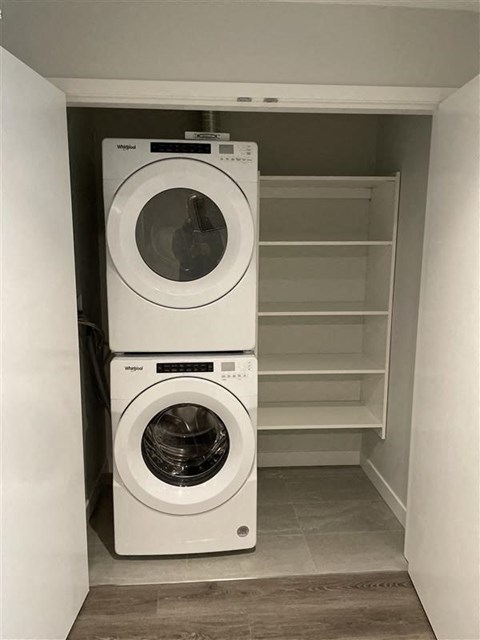a washing machine and a dryer in a closet