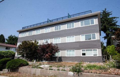 a large building with a balcony on top of it