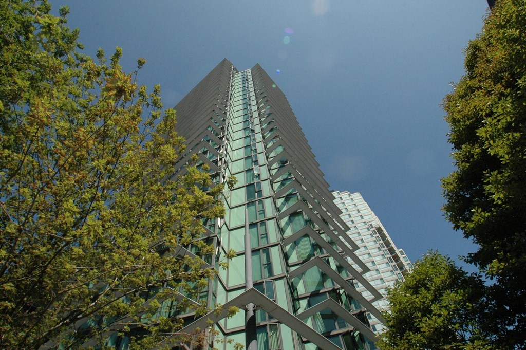a tall building with a blue sky in the background