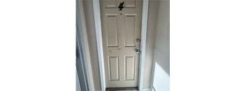 A white door with the number 42 on it.