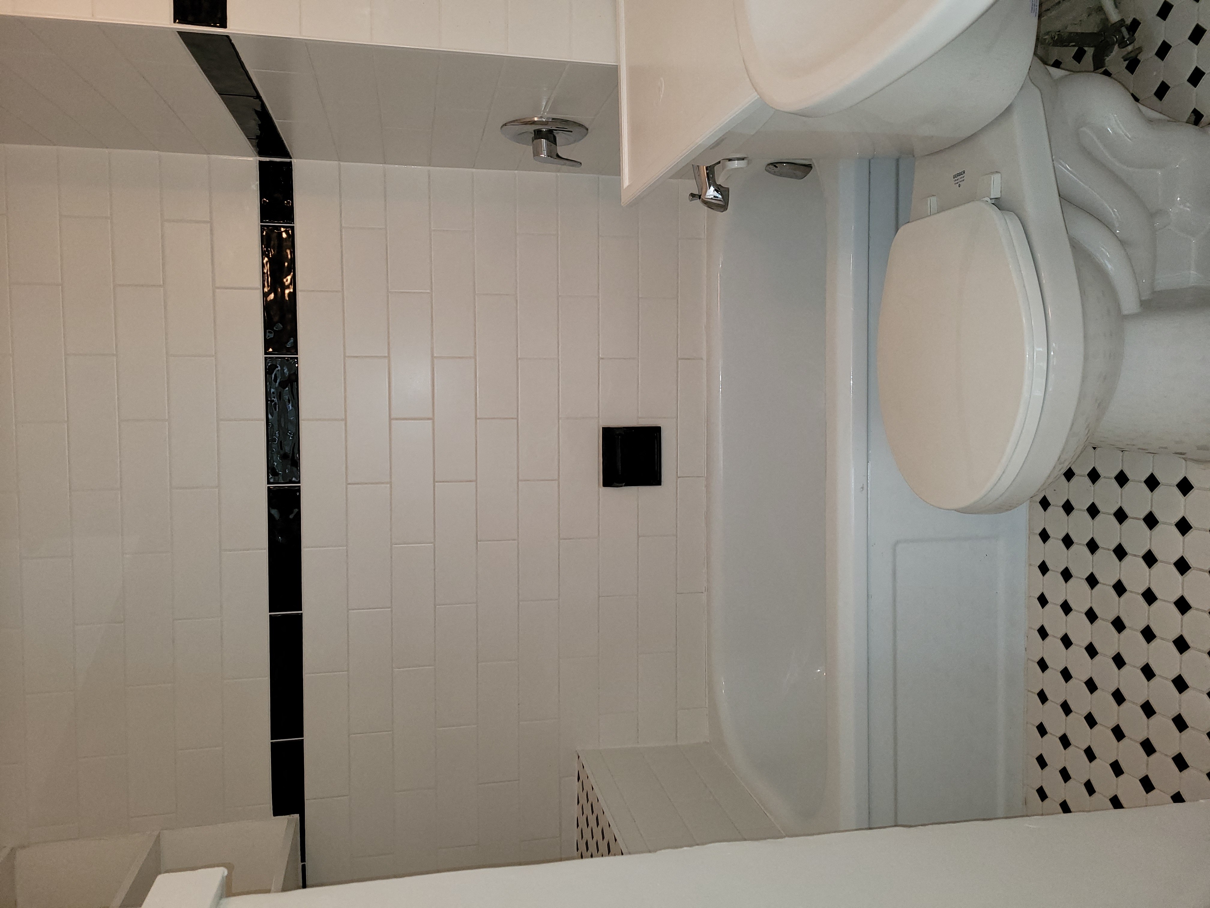 a bathroom with a toilet a sink and a shower