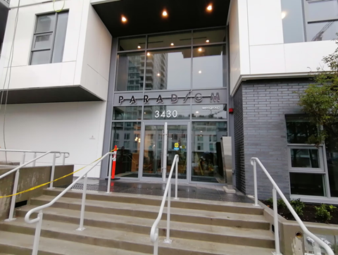 the entrance of a building with stairs in front of it