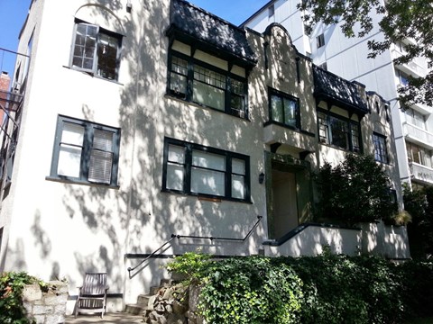 A white building with black trim and windows.