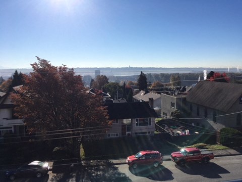 the view of the city from the roof of a house