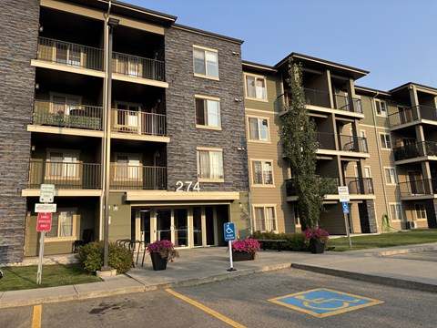 Apartment building 274 with a parking space in front.