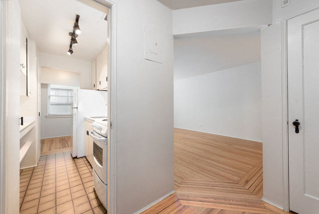 a kitchen and living room in a 555 waverly unit