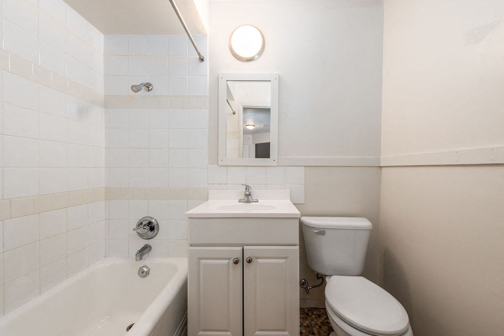 a bathroom with a sink toilet and bathtub