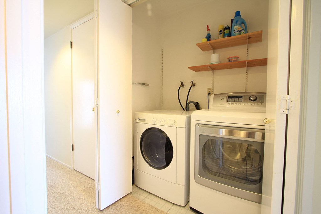 a laundry room with a washer and dryer