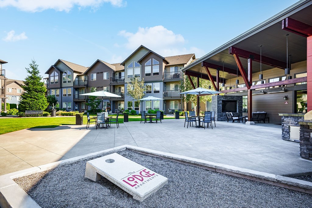 A large outdoor area with a pool table and a sign that says Levy.