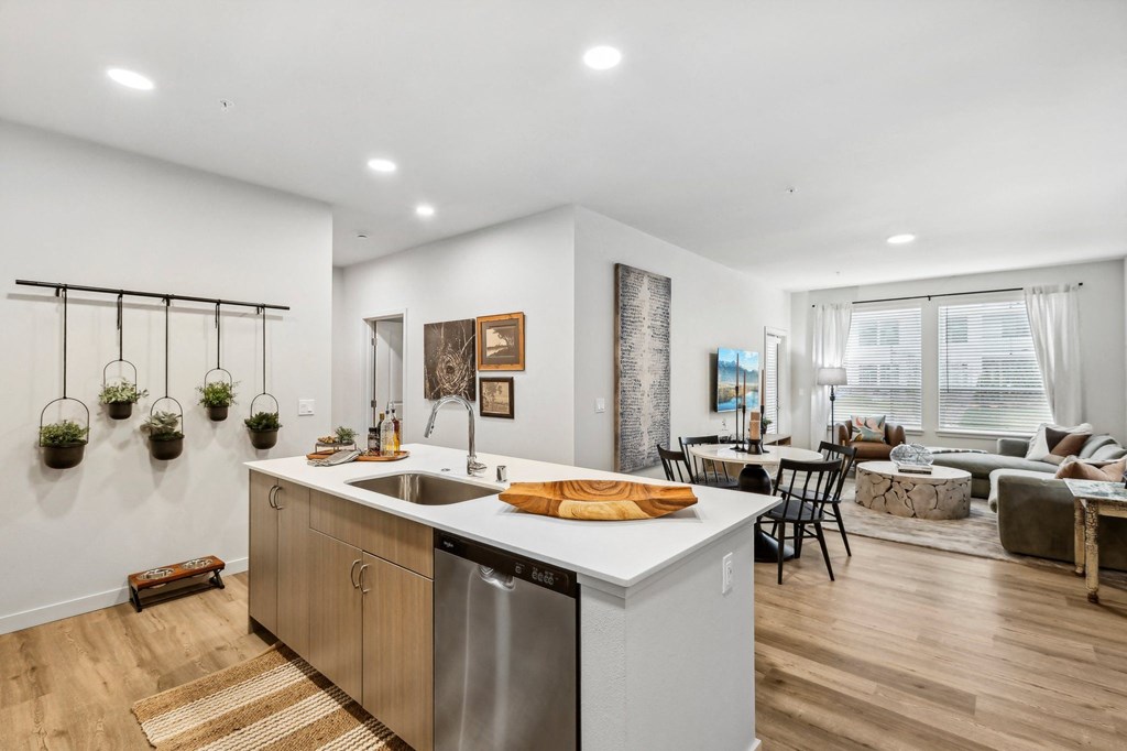 the preserve at ballantyne commons apartments clubhouse with kitchen and living room