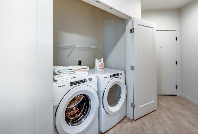 a white washer and dryer in a laundry room