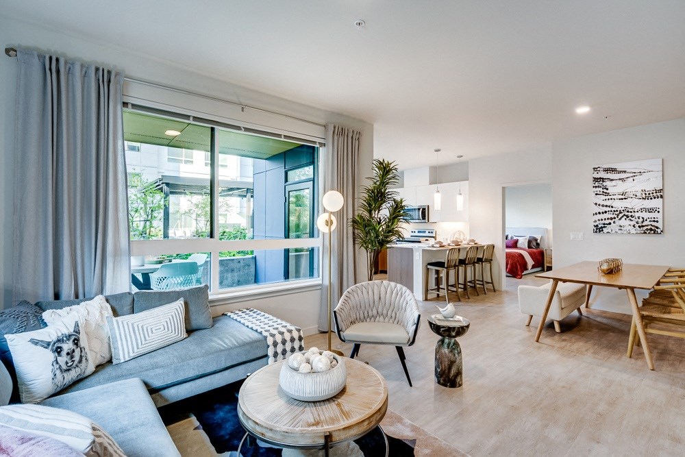 a living room and dining room with a couch and a table
