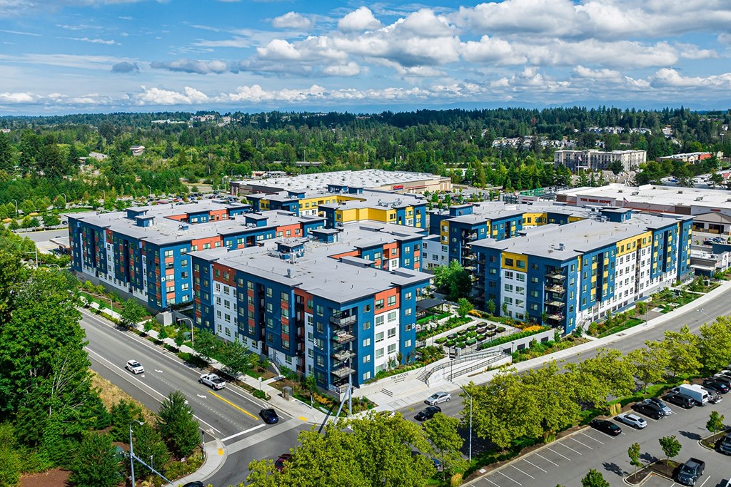 an aerial view of apartment buildings in a city