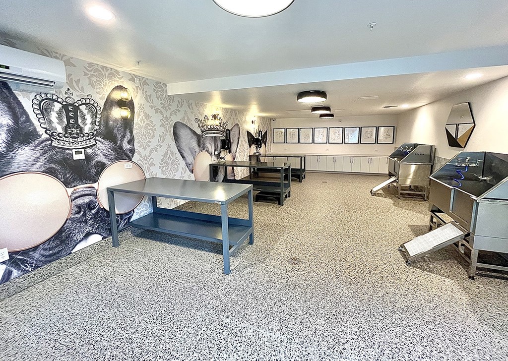 a room with a piano and a mural on the wall