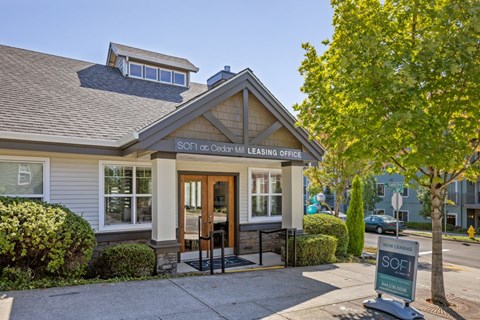 The front of a building with a sign that says "SOFI at Cedar W."