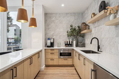a kitchen with wooden cabinets and a sink and a window