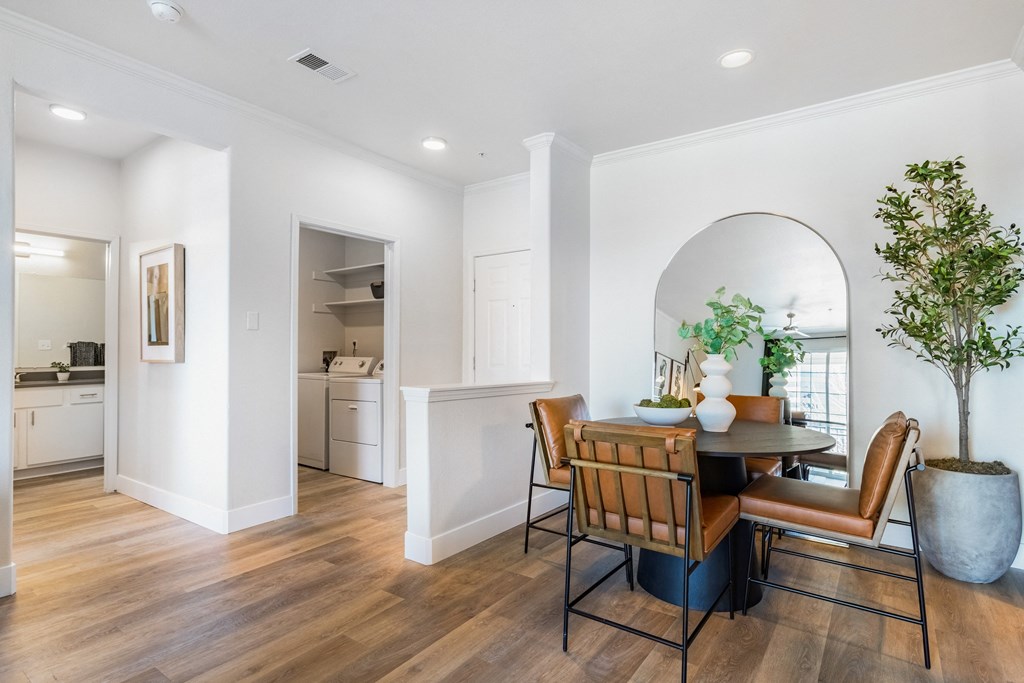 A dining room with a table and chairs. at The Viridian Apartments, Greenwood Village, CO